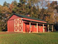 25x40x12 post-frame garage and ag building with 8' porch in Valencia, PA - end view in sunshine